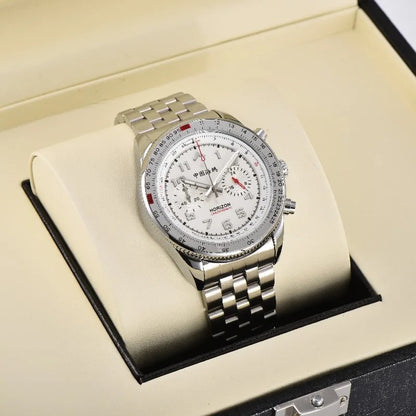 A silver-toned Horizon Chronograph watch with a white dial, red accents, and Chinese characters displayed on a cream pillow inside an open black presentation box